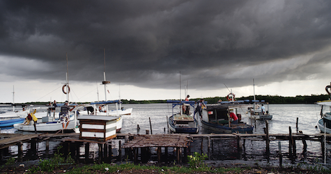 moored boats and stormy sky
